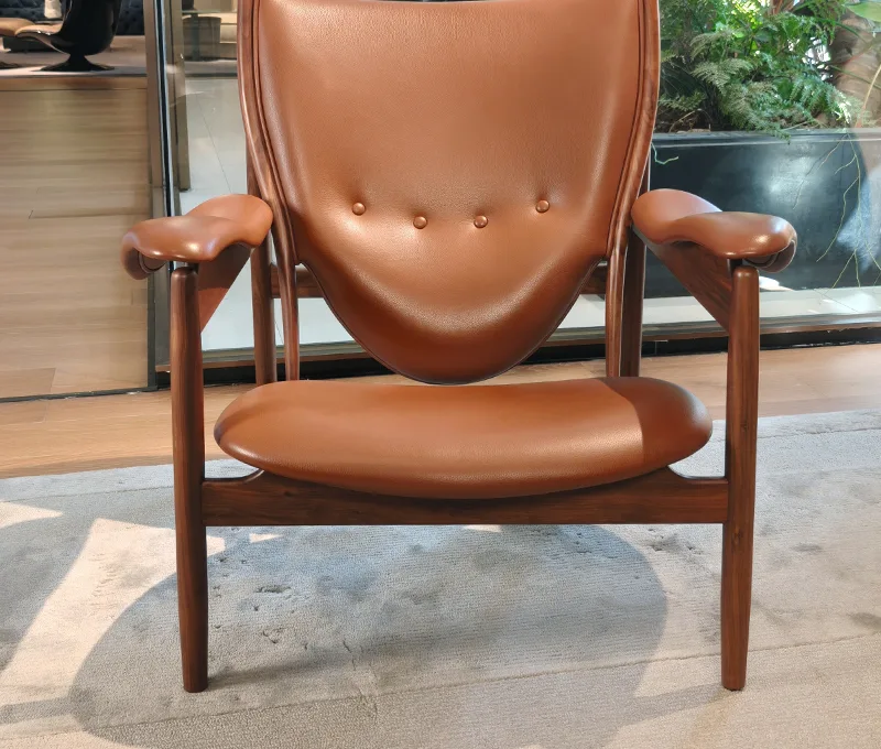 Tan leather armchair with walnut frame